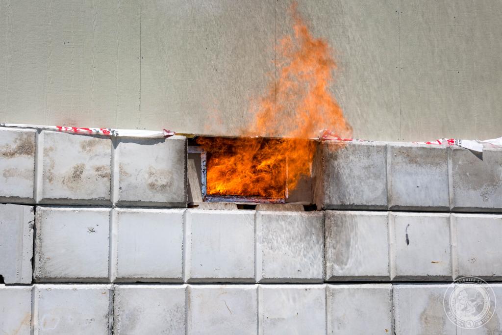 Understanding and Fighting Basement Fires flames from basement window
