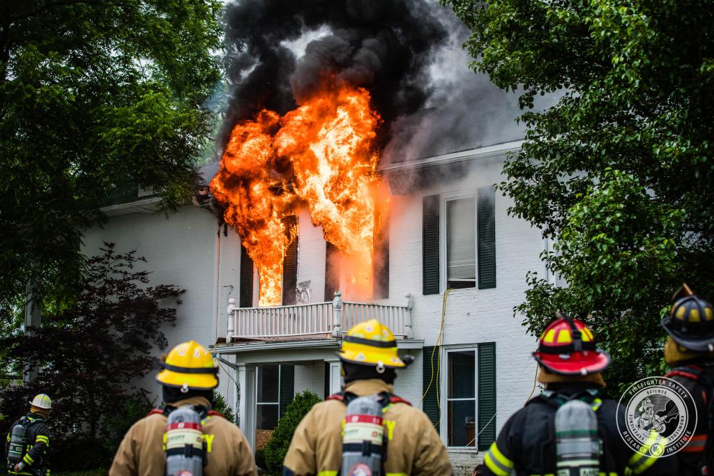 Windows on fire on large house