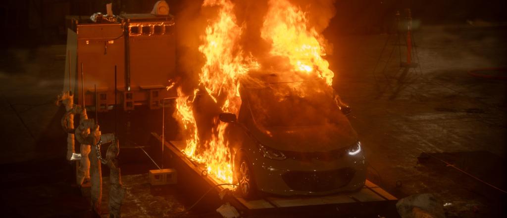 A fully involved vehicle fire captured during a series of EV fire experiments.