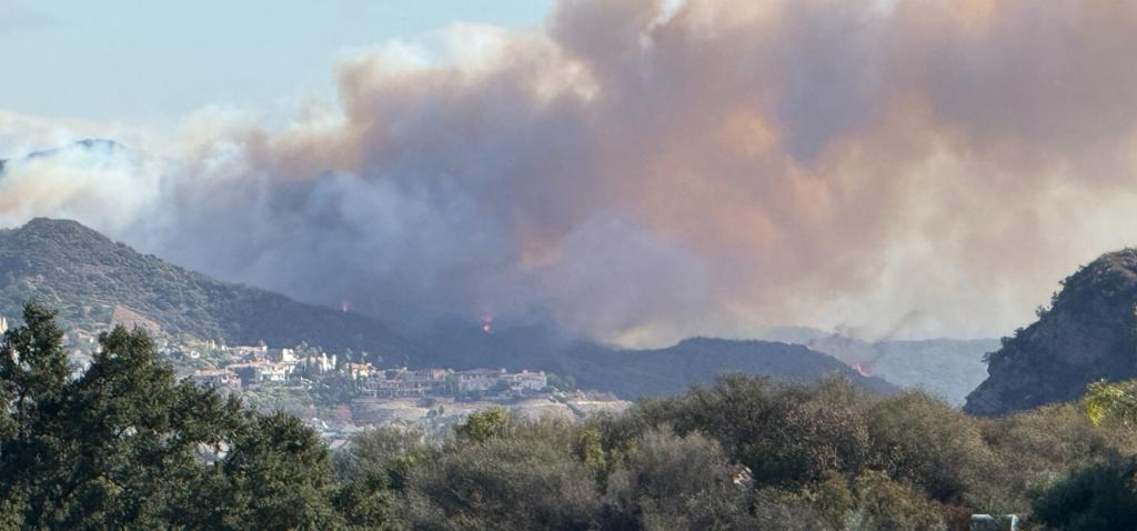 A wind-driven plume of smoke from fire spreading from wildland into the built environment during the Southern California fires in January 2025