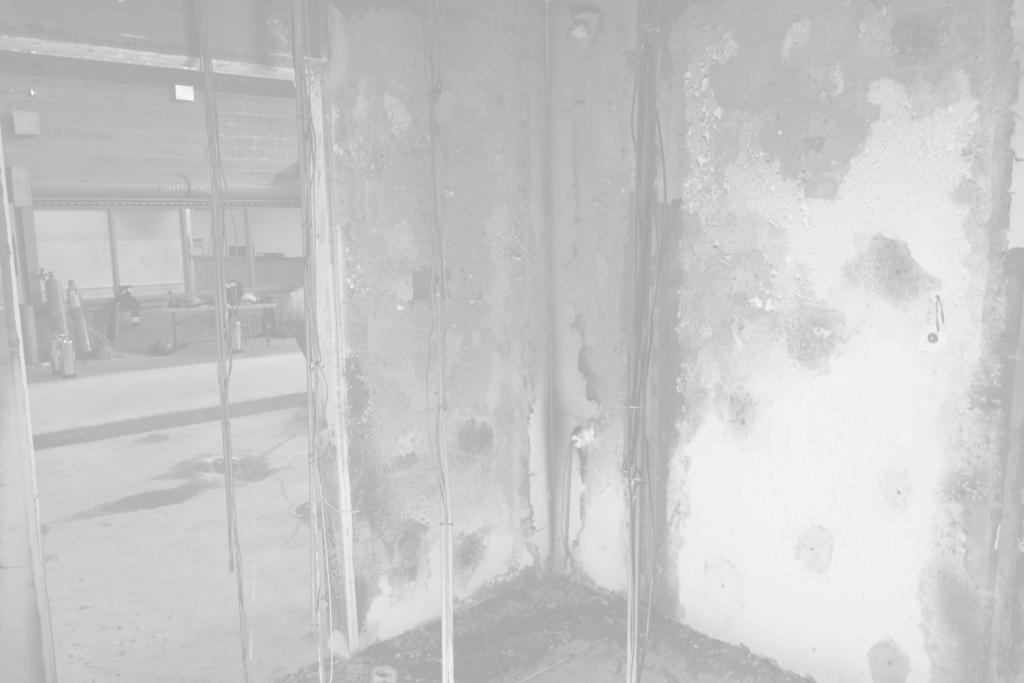 Fire patterns on a painted drywall surface